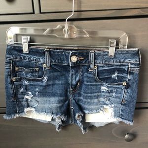 Medium wash AE mid rise denim shorts